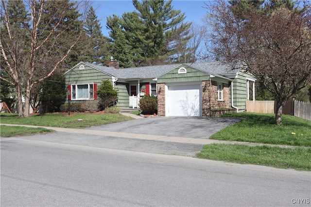 ranch-style house with aphalt driveway, a chimney, an attached garage, fence, and a front lawn