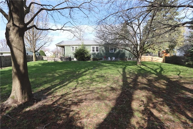 view of yard featuring fence