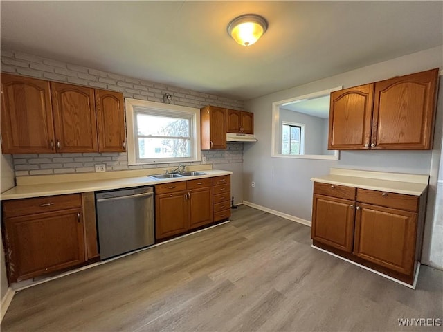 59 Park Ave, Tonawanda-City, NY 14150 - kitchen featuring dishwasher, baseboards, a sink, and brown cabinets