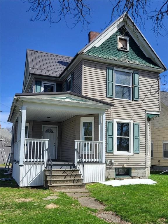309 Broadway St, Elmira City, NY 14904 - view of front facade featuring a chimney, a front lawn, and a porch