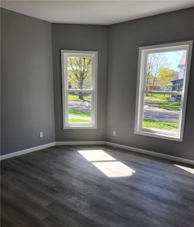 309 Broadway St, Elmira City, NY 14904 - unfurnished room with baseboards and dark wood-style flooring