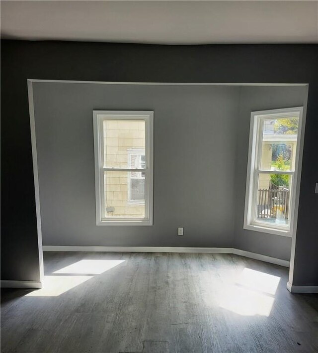 309 Broadway St, Elmira City, NY 14904 - unfurnished room with baseboards and wood finished floors