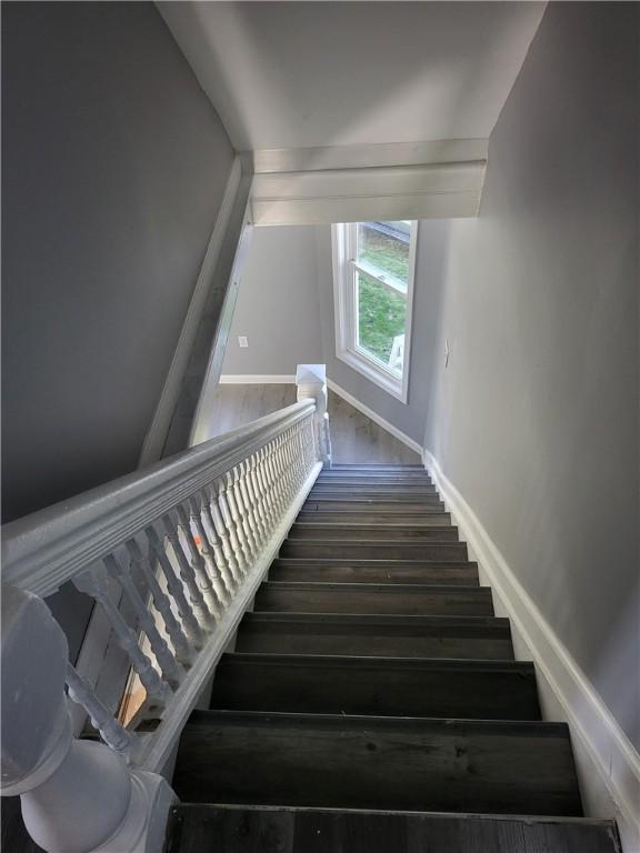 309 Broadway St, Elmira City, NY 14904 - staircase with baseboards and wood finished floors