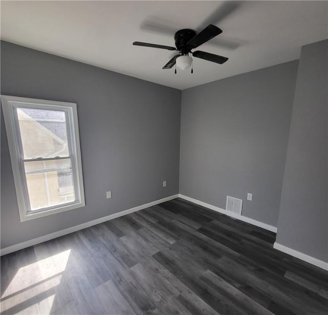 309 Broadway St, Elmira City, NY 14904 - unfurnished room with baseboards, visible vents, ceiling fan, and dark wood finished floors