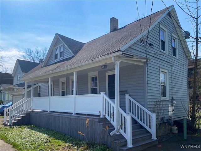 3 Oakwood Ave, Lancaster, NY 14086 - view of side of property with a porch, a chimney, roof with shingles, and stairs