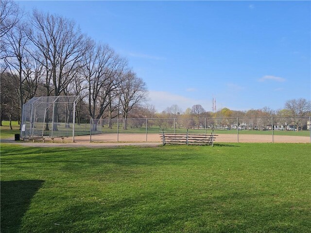 view of home's community featuring a yard and fence