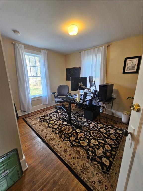 office area featuring wood finished floors and baseboards