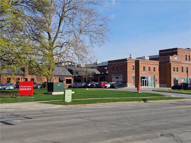 view of building exterior with uncovered parking