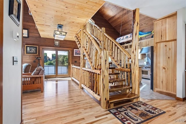 42795 Paynes Lake Camp Rd, Antwerp, NY 13608 - stairs with high vaulted ceiling, wooden ceiling, wood finished floors, and wooden walls