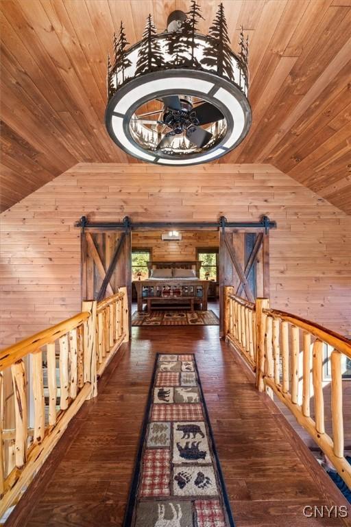 42795 Paynes Lake Camp Rd, Antwerp, NY 13608 - hallway with a barn door, lofted ceiling, and wooden ceiling