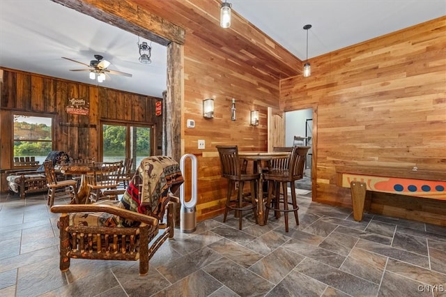 42795 Paynes Lake Camp Rd, Antwerp, NY 13608 - dining area featuring wooden walls, stone tile flooring, and ceiling fan