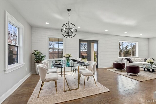 dining area with a healthy amount of sunlight, recessed lighting, a chandelier, and baseboards