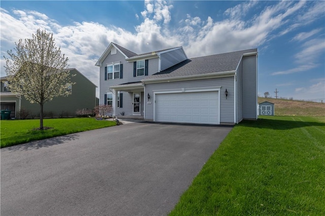 traditional home with a front lawn, driveway, a storage unit, and a garage