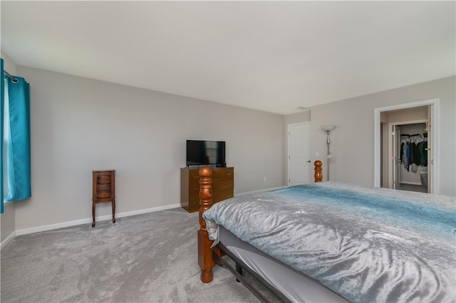 bedroom with baseboards and carpet floors