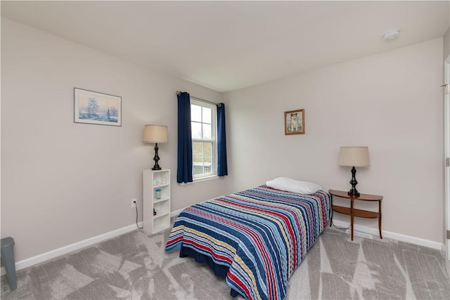 carpeted bedroom with baseboards
