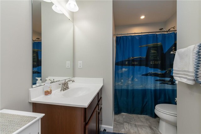 full bath featuring toilet, vanity, and a shower with shower curtain