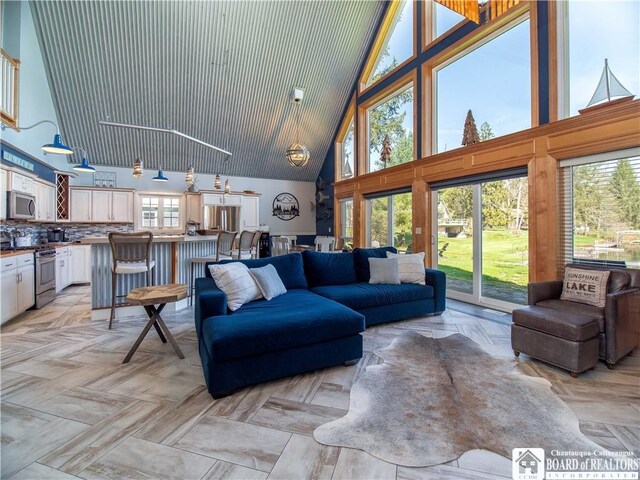 living room with high vaulted ceiling