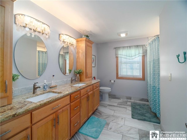 full bath with toilet, a shower with curtain, a sink, and double vanity