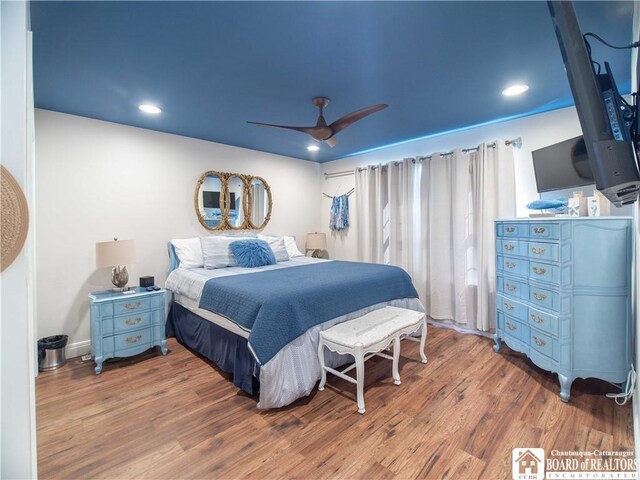 bedroom featuring recessed lighting, wood finished floors, and a ceiling fan