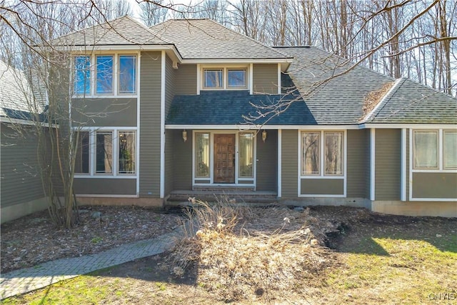 view of front of property featuring roof with shingles
