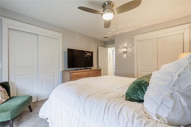 carpeted bedroom featuring a closet and ceiling fan