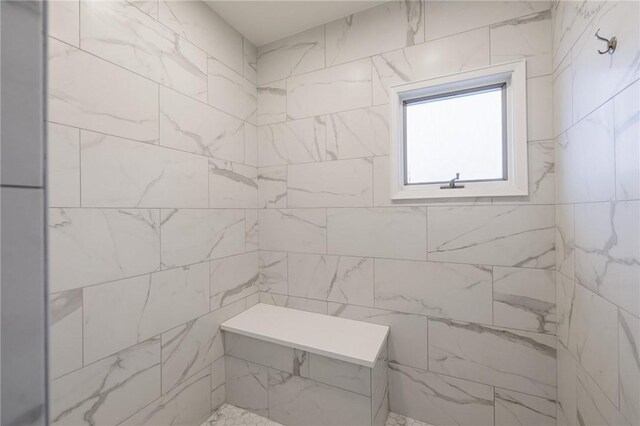 bathroom featuring tiled shower