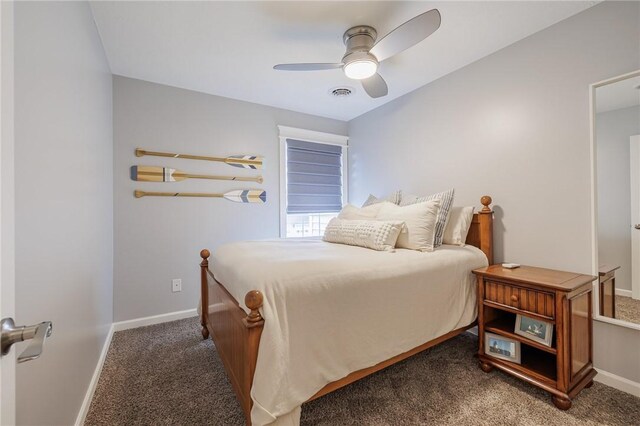 carpeted bedroom with baseboards, a ceiling fan, and visible vents