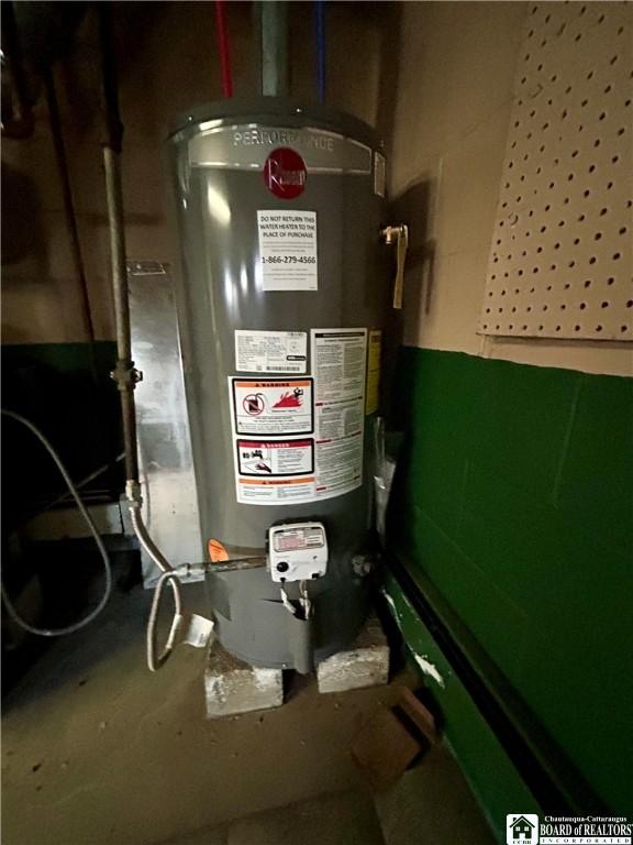 utility room featuring gas water heater