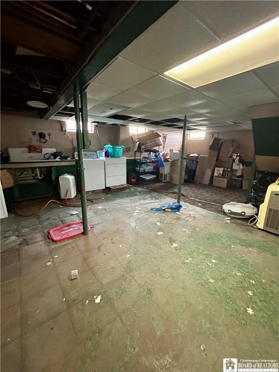 unfinished basement with separate washer and dryer