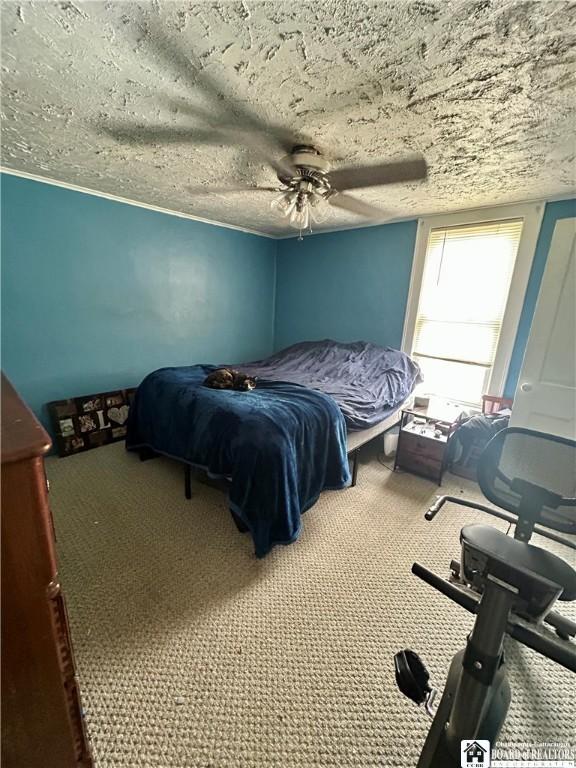 bedroom featuring carpet flooring and ceiling fan