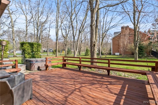wooden deck featuring a hot tub