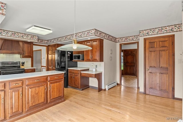 kitchen with premium range hood, a baseboard radiator, appliances with stainless steel finishes, and light countertops