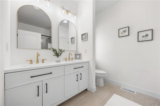7717 Roberts St, Lenox, NY 13032 - full bathroom with visible vents, toilet, baseboards, and a sink