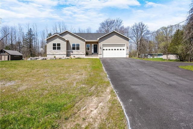 7717 Roberts St, Lenox, NY 13032 - single story home with an attached garage, a front yard, aphalt driveway, and stone siding