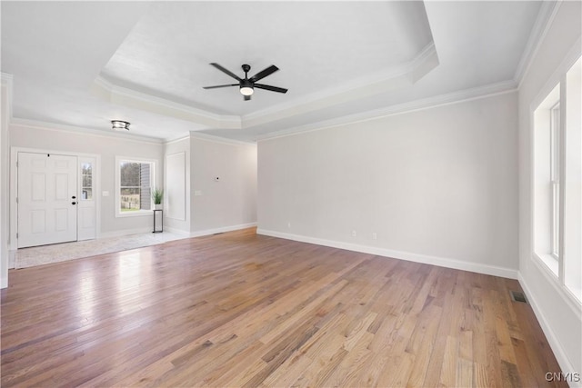 7717 Roberts St, Lenox, NY 13032 - unfurnished living room featuring a ceiling fan, crown molding, light wood finished floors, and a raised ceiling