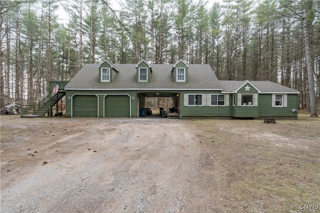 5410 N Shore Rd, Greig, NY 13312 - cape cod house with dirt driveway, an attached garage, stairway, and roof with shingles