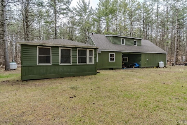 5410 N Shore Rd, Greig, NY 13312 - back of house with a lawn and a shingled roof