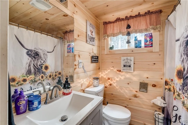 5410 N Shore Rd, Greig, NY 13312 - bathroom featuring wooden ceiling, toilet, wood walls, and vanity