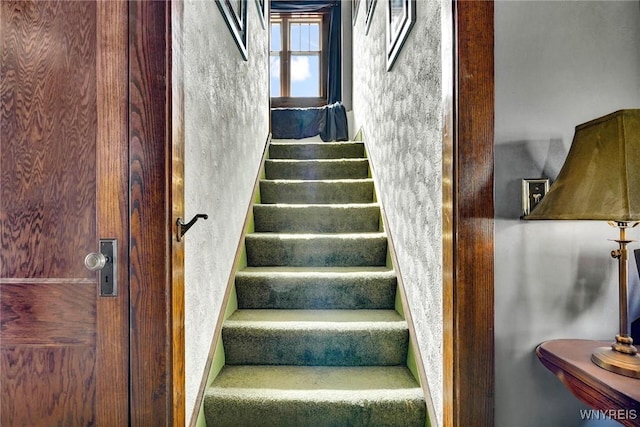 stairs with a textured wall