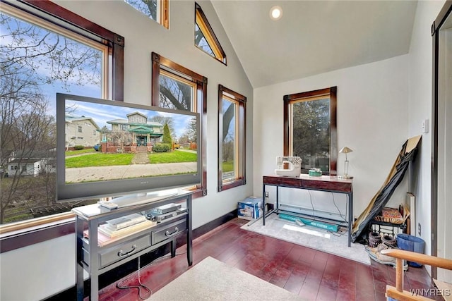 sitting room featuring hardwood / wood-style flooring, high vaulted ceiling, baseboards, and recessed lighting