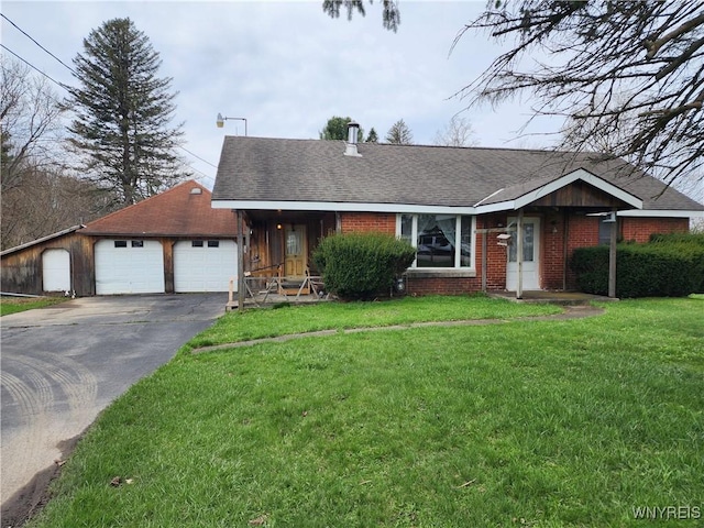 ranch-style home featuring a front lawn, driveway, a shingled roof, an attached garage, and brick siding