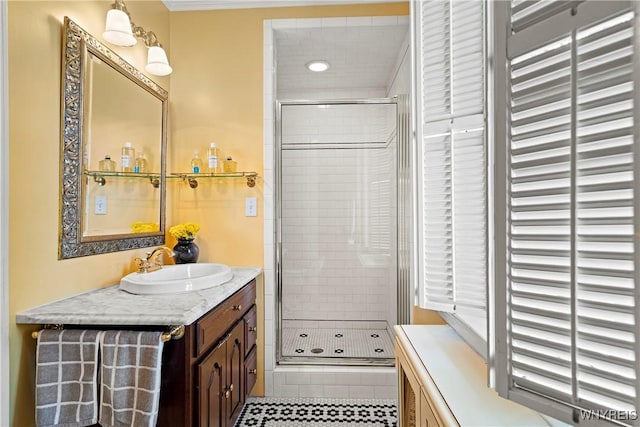 bathroom featuring recessed lighting, tile patterned flooring, vanity, ornamental molding, and a stall shower