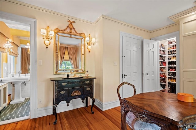 interior space with baseboards and wood finished floors