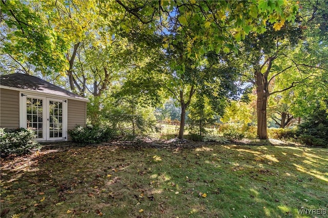 view of yard featuring french doors