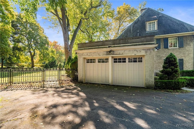 garage featuring fence