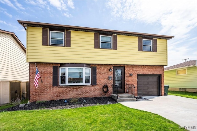 colonial inspired home featuring brick siding, an attached garage, and a front lawn
