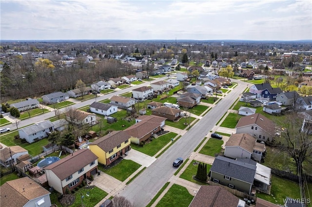 birds eye view of property with a residential view