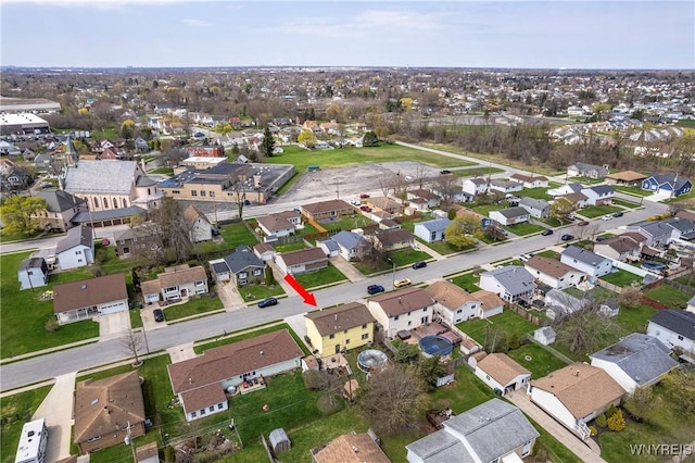 birds eye view of property with a residential view