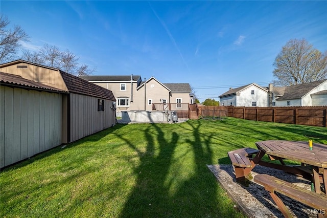 view of yard with a residential view and fence