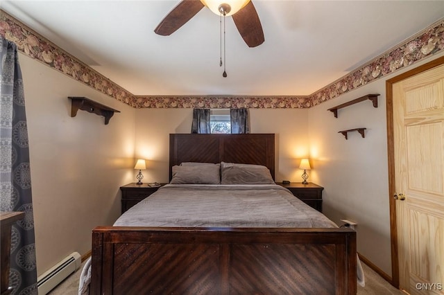 carpeted bedroom with a baseboard radiator, a ceiling fan, and baseboards